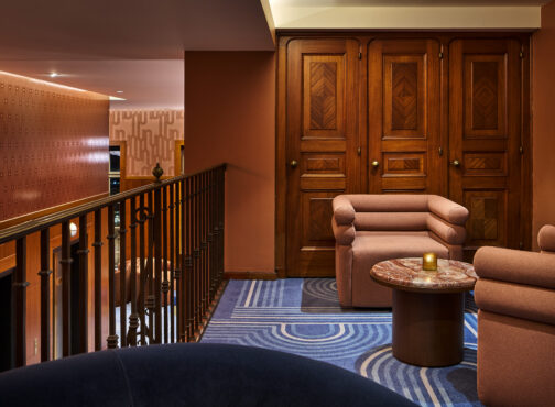 A luxurious room featuring an elegant blue carpet that enhances the sophisticated ambiance.